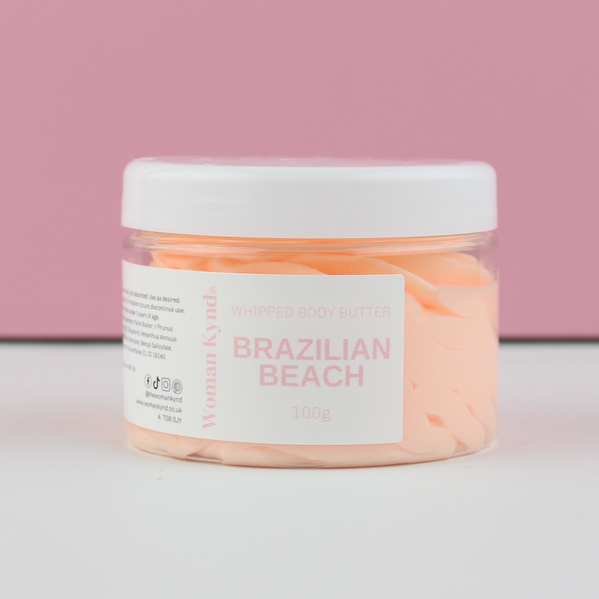 Jar of 'Brazilian Beach' body butter with a pink label on a white background