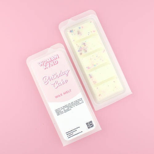 Two images of a Woman Kynd five segment cream coloured Wax Melt with multicoloured glitter, both in a frosted clamshell. The first image displays the pink and white label with the words Woman Kynd Birthday Cake Wax Melt and the CLP information, and the other image is of the reverse side showing the Wax Melt Itself. Both images are against a solid pink background.