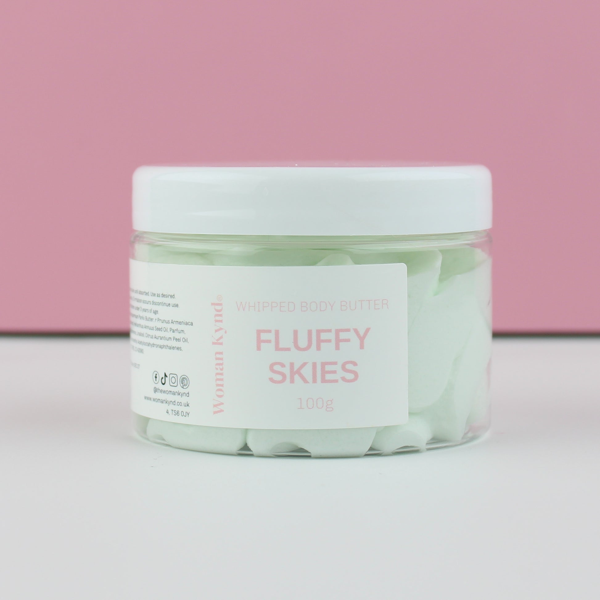 Jar of 'Fluffy Skies' whipped body butter with a pink background
