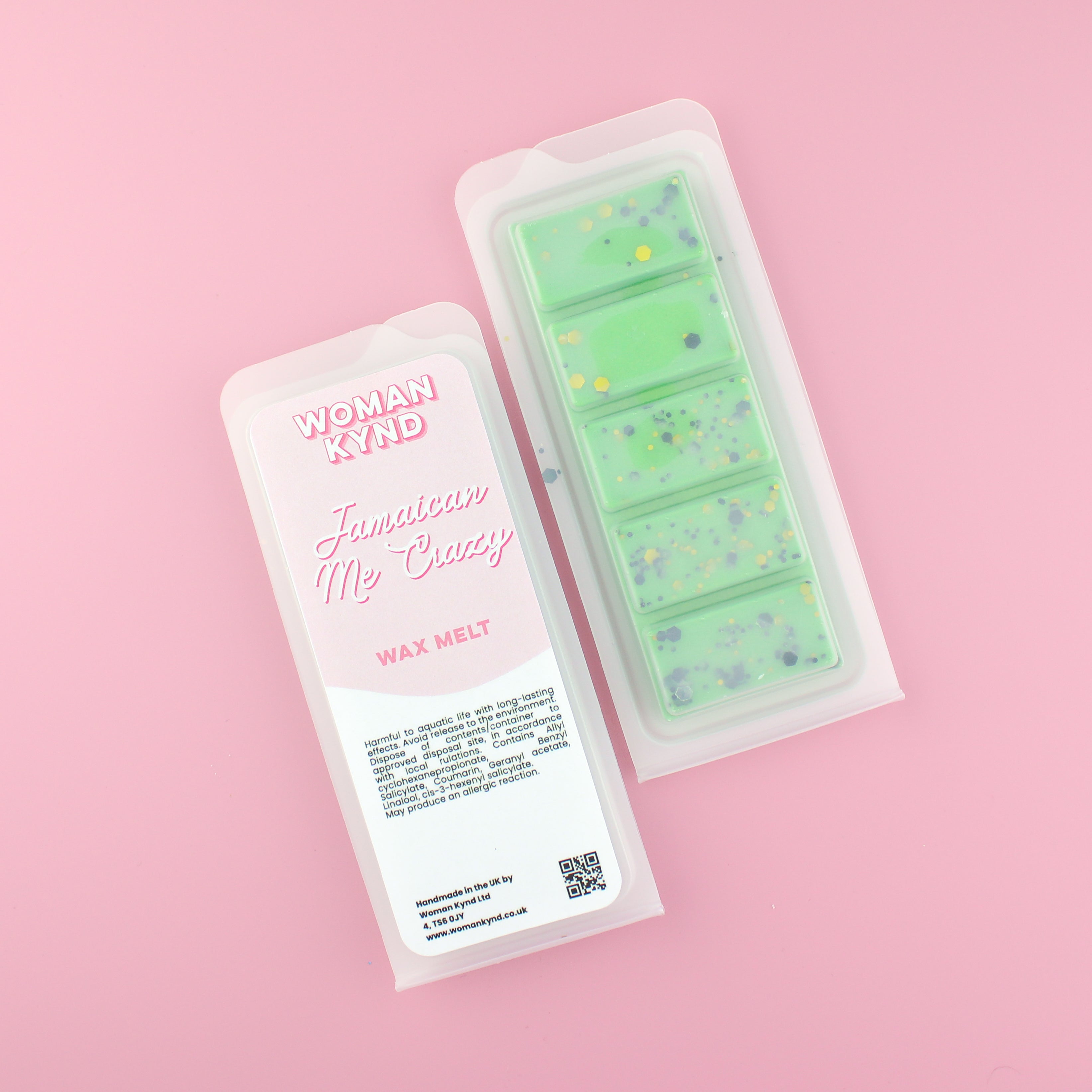 Two images of a Woman Kynd five segment green Wax Melt with black and yellow glitter, both in a frosted clamshell. The first image displays the pink and white label with the words Woman Kynd Jamaican Me Crazy Wax Melt and the CLP information, and the other image is of the reverse side showing the Wax Melt Itself. Both images are against a solid pink background.