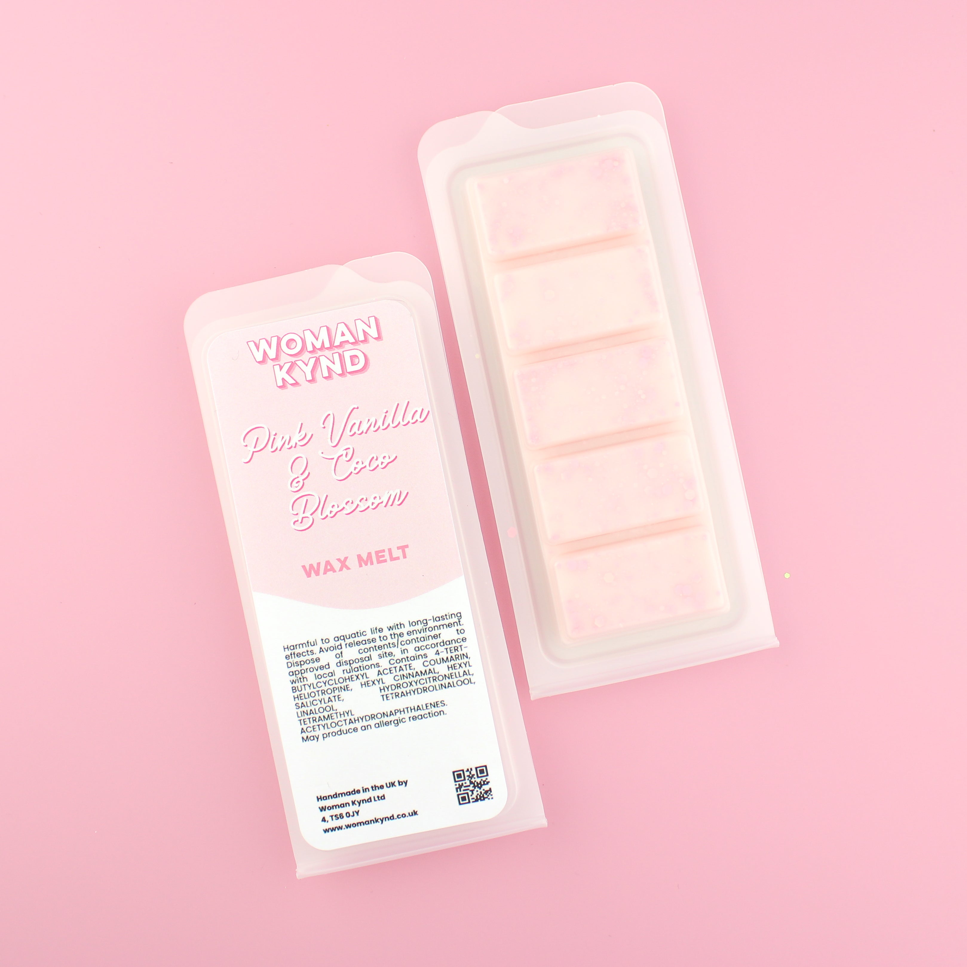 Two images of a Woman Kynd five segment pale pink Wax Melt with pink glitter, both in a frosted clamshell. The first image displays the pink and white label with the words Woman Kynd Pink Vanilla & Coco Blossom Wax Melt and the CLP information, and the other image is of the reverse side showing the Wax Melt Itself. Both images are against a solid pink background.