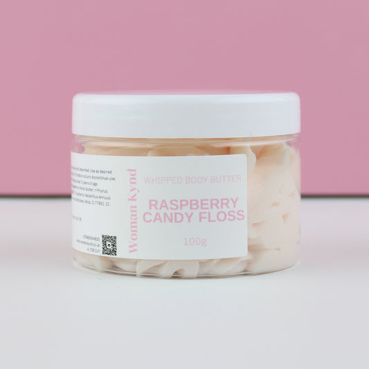Jar of raspberry candy floss whipped body butter with a pink background