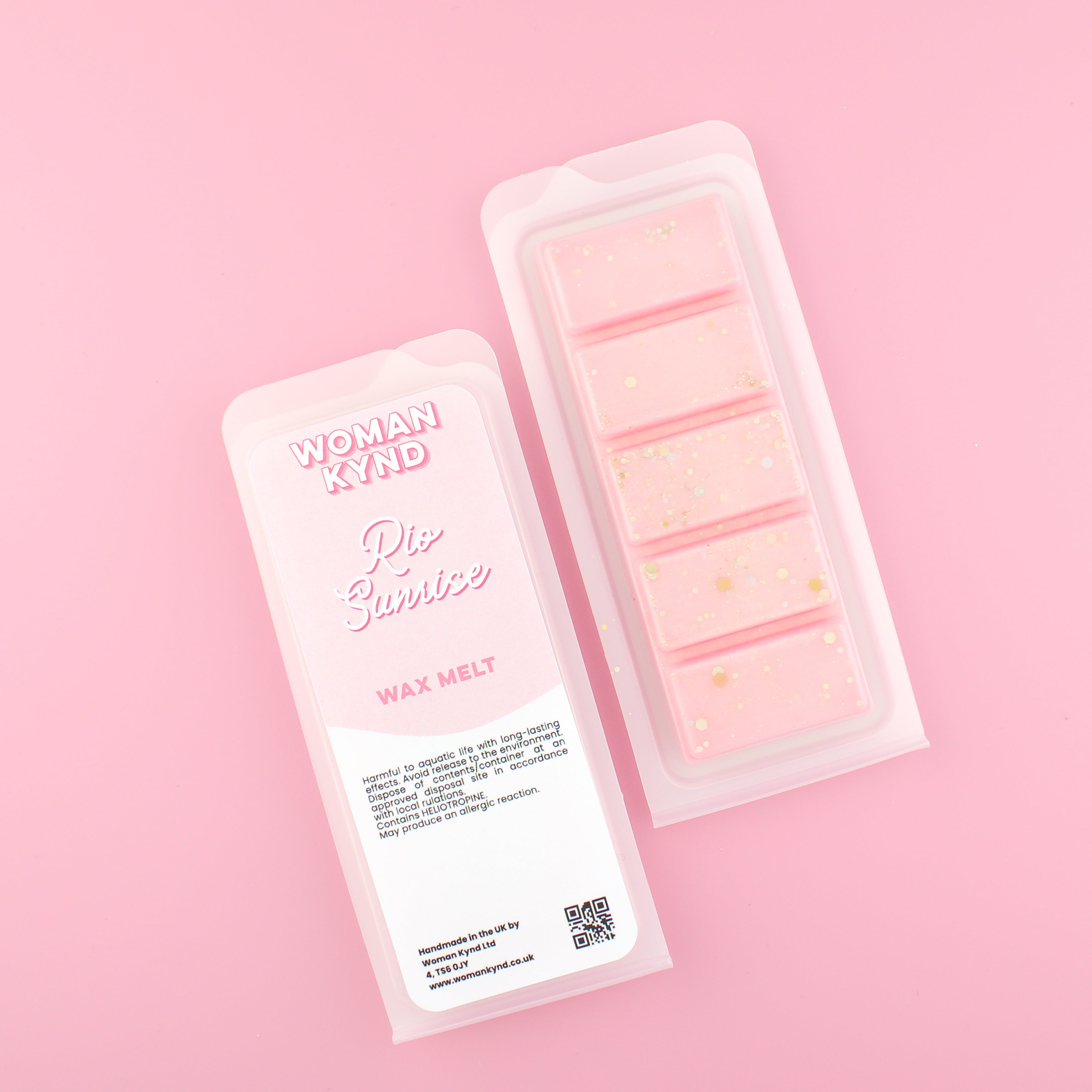 Two images of a Woman Kynd five segment light pink Wax Melt with gold glitter, both in a frosted clamshell. The first image displays the pink and white label with the words Woman Kynd Rio Sunrise Wax Melt and the CLP information, and the other image is of the reverse side showing the Wax Melt Itself. Both images are against a solid pink background.