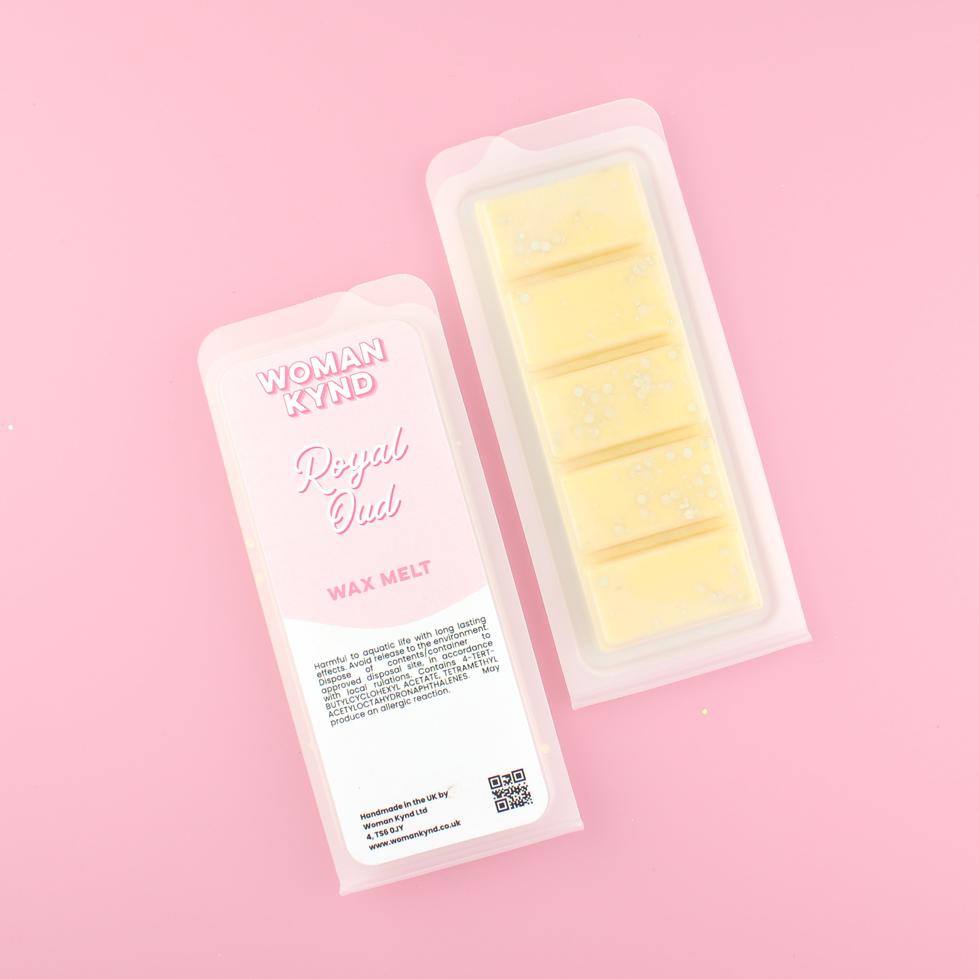 Two images of a Woman Kynd five segment pale yellow Wax Melt with gold glitter, both in a frosted clamshell. The first image displays the pink and white label with the words Woman Kynd Royal Oud Wax Melt and the CLP information, and the other image is of the reverse side showing the Wax Melt Itself. Both images are against a solid pink background.