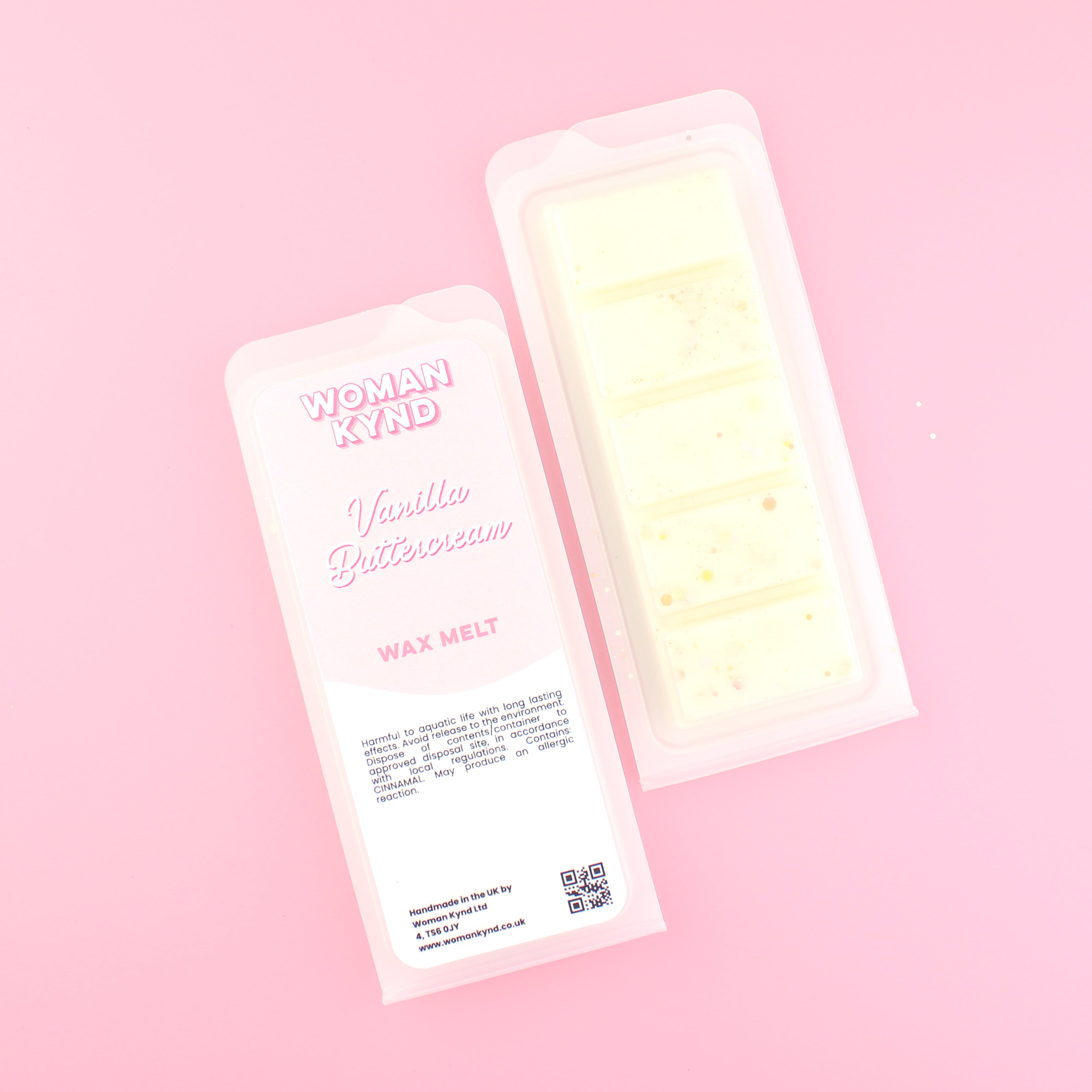 Two images of a Woman Kynd five segment off-white Wax Melt with gold glitter, both in a frosted clamshell. The first image displays the pink and white label with the words Woman Kynd Vanilla Buttercream Wax Melt and the CLP information, and the other image is of the reverse side showing the Wax Melt Itself. Both images are against a solid pink background.