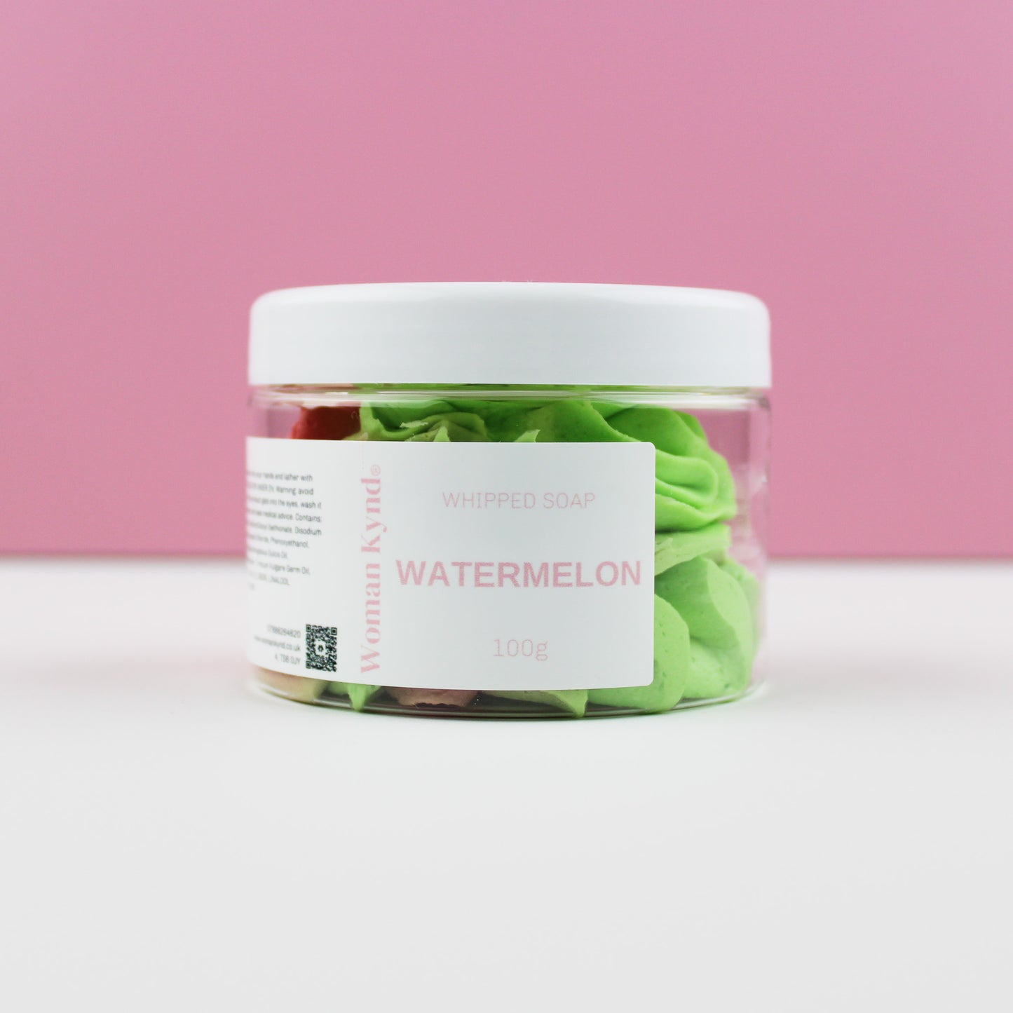 A clear jar filled with green whipped soap, labeled 'WATERMELON' on a pink background.